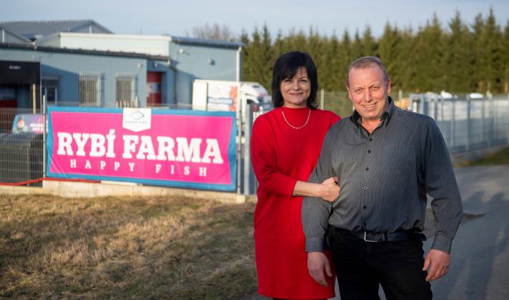 Jan Hora and his wife in front of the Hora's fish farm