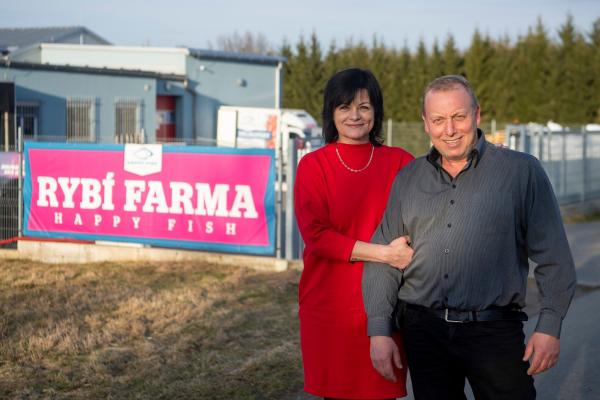 Jan Hora and his wife in front of the Hora's fish farm