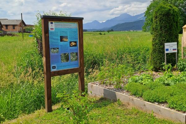 Information board in the “honey garden” at the fish farm entrance