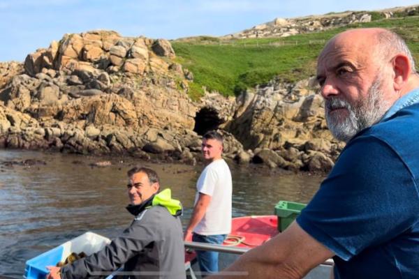 Antonio Muiños (right) re-stocking local urchin fishery with son Anton (middle) and A Coruña Cofradía biologist Pablo Sánchez